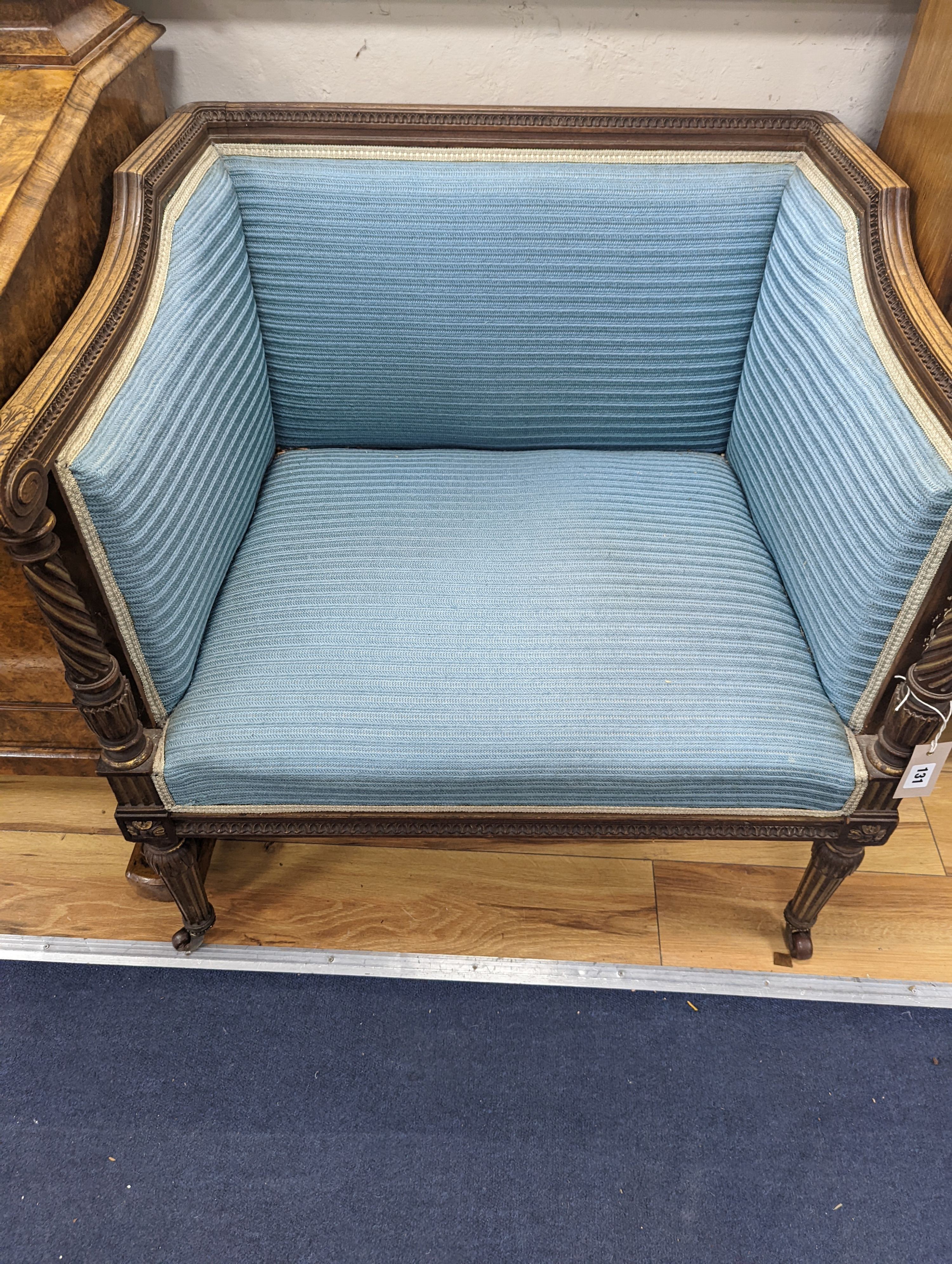 A pair of French walnut and parcel gilt Bergere chairs, width 71cm, depth 59cm, height 72cm